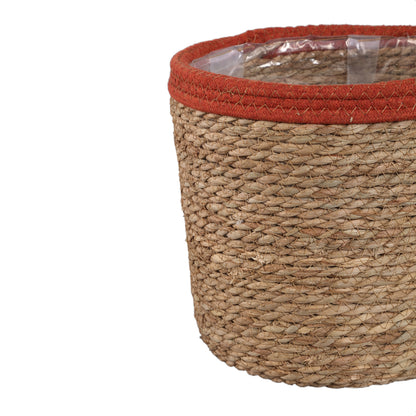 Rotan mand met roestkleurige rand van PTMD, grootste maat 28x28x26cm